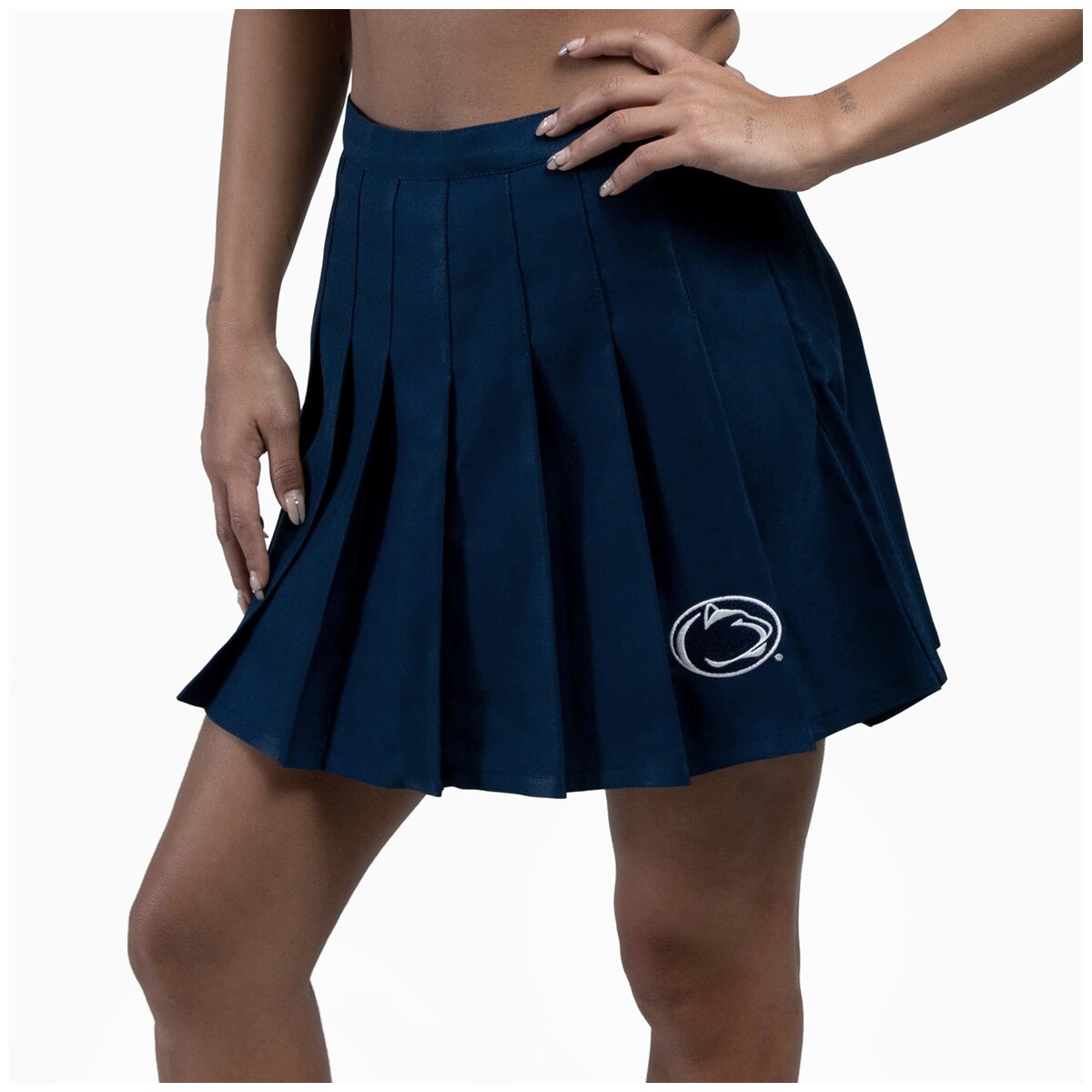 model wearing navy women's tennis skirt with embroidered Penn State Athletic Logo